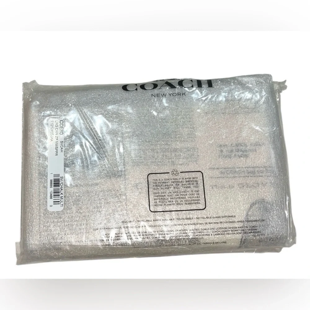 COACH LARGE CORNER ZIP WRISTLET WITH NEWSPAPER PRINT